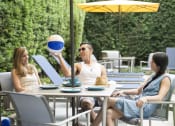 Thumbnail 26 of 33 - People relaxing outdoors at Wilshire Vermont, Los Angeles, 90010