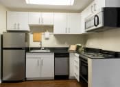 Thumbnail 5 of 33 - Kitchen with modern appliances at Wilshire Vermont, CA 90010