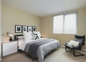 Thumbnail 9 of 33 - Bedroom with modern recliner chair at Wilshire Vermont, Los Angeles, California