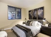 Thumbnail 10 of 33 - primary bedroom with large bed at Wilshire Vermont, Los Angeles, CA