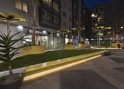 Thumbnail 27 of 33 - Exterior during nighttime at apartment building at Wilshire Vermont, Los Angeles, CA 90010