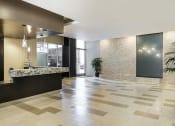 Thumbnail 28 of 33 - Lobby with front desk and modern interior decoration for apartments near koreatown at Wilshire Vermont, 90010