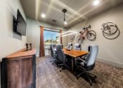 Thumbnail 6 of 39 - Private Conference Room with Table and Chairs at Legacy Creekside Apartments, Texas, 78251