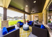 Thumbnail 24 of 39 - Clubhouse Outdoor Seating Area Overlooking Pool Area at Legacy Creekside Apartments, San Antonio, 78251