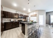 Thumbnail 33 of 39 - Model 2 - Open Floor Plan with Kitchen Island & Private Patio at Legacy Creekside Apartments, San Antonio, TX