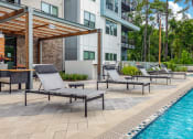 Thumbnail 17 of 70 - Poolside Sun Deck at JTB Apartments, Jacksonville, FL, 32256