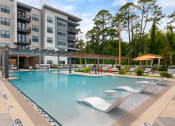 Thumbnail 20 of 70 - Pool patio at JTB Apartments, Jacksonville, Florida