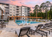 Thumbnail 28 of 70 - Twilight view of pool at JTB Apartments, Jacksonville