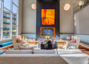 Thumbnail 25 of 45 - a living room with a large couch and a fireplace at Artisan Twickenham Square, Huntsville, 35801