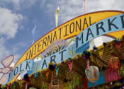 Thumbnail 22 of 22 - a fair with a sign that says international folk art market  at Altitude at Vizcaya, Santa Fe