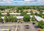 Thumbnail 16 of 16 - apartment complex with off-street parking