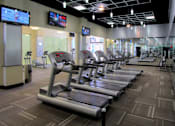 Thumbnail 6 of 50 - Luxury apartments with huge fitness center with multiple varieties of workout equipment, free weights, yoga and spin rooms at The Lanesborough Apartments in Houston