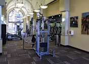 Thumbnail 31 of 50 - Luxury apartments with huge fitness center with multiple varieties of workout equipment, free weights, yoga and spin rooms at The Lanesborough Apartments in Houston