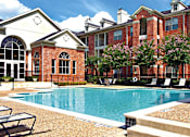 Thumbnail 2 of 50 - Luxury apartments with large swimming pool, multiple swimming pools, spa, and large sundeck with poolside lounge chairs at The Lanesborough Apartments in Houston