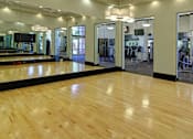 Thumbnail 25 of 50 - Luxury apartments with huge fitness center with multiple varieties of workout equipment, free weights, yoga and spin rooms at The Lanesborough Apartments in Houston