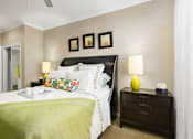 Thumbnail 22 of 50 - Spacious bedroom with walk-in closet and ceiling fan at The Lanesborough Apartments in Houston.