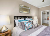 Thumbnail 45 of 50 - Spacious bedroom with walk-in closet and ceiling fan at The Lanesborough Apartments in Houston.