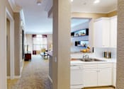 Thumbnail 22 of 28 - Spacious living room, spacious dining room, kitchen with granite countertops, white cabinets, and breakfast bar at Tuscany Court Apartments in Houston.