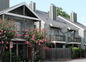 Thumbnail 21 of 42 - Gated apartment community conveniently located in the Bayou area of Houston with lush landscaping, scenic views, and reserved and covered parking.