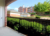 Thumbnail 22 of 38 - Luxury apartments with red brick exteriors, spacious balcony, and lush landscaping at TurtleCreek apartments in West Des Moines, Iowa