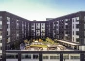 Thumbnail 7 of 36 - Aerial photo of building view from the west of courtyard and apartments