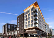 Thumbnail 8 of 36 - Southwest corner view of glass balconies and windows
