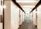 Thumbnail 11 of 36 - Hallway with LED sconces at each door