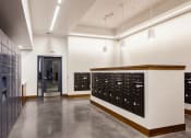 Thumbnail 18 of 36 - Mail room with package lockers and mailboxes