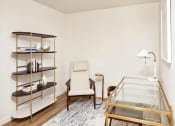 Thumbnail 19 of 36 - Den with desk and book shelf and lounge chair