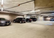Thumbnail 20 of 36 - Covered parking garage with assigned car parking