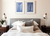 Thumbnail 27 of 36 - Queen bed with headboard, night stands, and pictures hung on wall