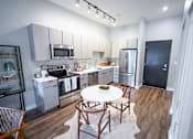 Thumbnail 6 of 47 - You are now viewing the kitchen and breakfast area in a model apartment  at Grand Flats, St. Louis, 63104