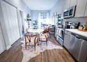 Thumbnail 7 of 47 - This is an alternate view of the breakfast area in the kitchen of a model apartment  at Grand Flats, St. Louis, Missouri