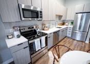 Thumbnail 8 of 47 - Here we have a closer look at the kitchen appliances, cabinets and countertops  at Grand Flats, St. Louis, MO, 63104