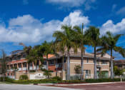 Thumbnail 1 of 18 - Preserve at Boynton Beach community exterior with palm trees at Preserve at Boynton Beach, Boynton Beach, Florida