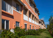Thumbnail 18 of 18 - Preserve at Boynton Beach community exterior with palm trees at Preserve at Boynton Beach, Boynton Beach