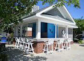 Thumbnail 15 of 18 - poolside entertaining and social hangout space with seating for friends and family