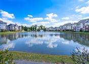 Thumbnail 17 of 18 - stocked fishing lake at the heart of Harbour Breeze Apartment complex