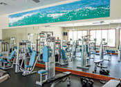 Thumbnail 5 of 29 - interior fitness center with resistance machines and free weights