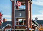 Thumbnail 28 of 29 - entrance tower with waterdrop logo at main entrance to 1200 Acqua