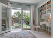 Thumbnail 10 of 14 - bedroom with french doors
