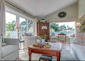 Thumbnail 7 of 14 - living area with brown coffee table