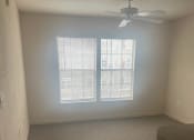 Thumbnail 16 of 25 - Bedroom with window and ceiling fan with light at MADISON MANOR, Florida