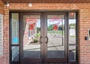 Thumbnail 18 of 31 - the secured access entry to Muskego School Apartments main building