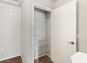 Thumbnail 10 of 31 - a pantry/closet with built-in shelving in a home at Muskego School Apartments