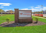 Thumbnail 31 of 31 - The monument sign beside the road at Muskego School Apartments