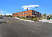 Thumbnail 17 of 31 - The entrance to Muskego School Apartments on Janesville Road