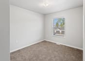 Thumbnail 9 of 31 - a large carpeted bedroom with overhead lighting and a window at Muskego School
