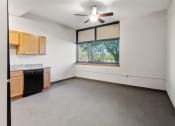 Thumbnail 13 of 31 - a spacious kitchen with a ceiling fan at Muskego School Apartments in Muskego, WI