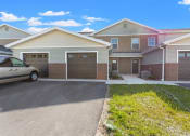Thumbnail 26 of 31 - Private driveways and garages at Muskego School Apartments in Muskego, WI